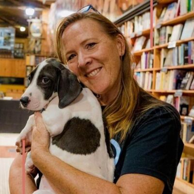 Cara Achterberg is an author with her dog at a book store
